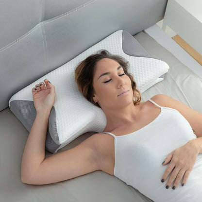 Woman resting comfortably on the AlignRest contour pillow